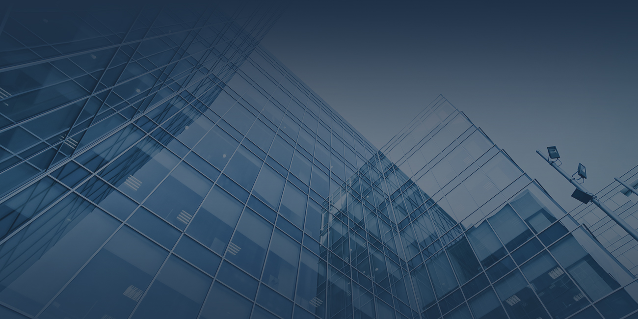 A blue building stands against a clear blue sky, creating a harmonious blend of colors in the scene.